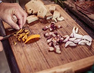Food being cut on chopping board (Alamy)