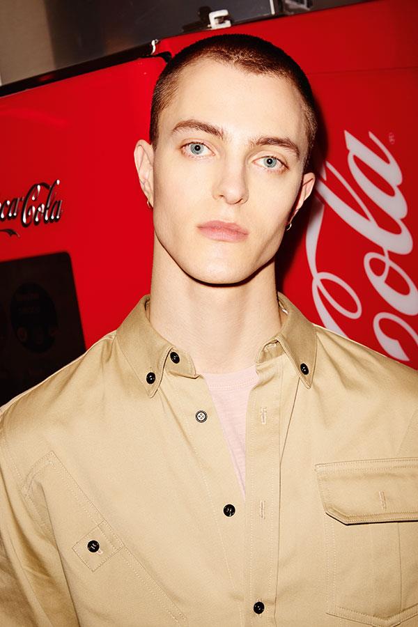 Two guys at Five Guys FS magazine style shoot. Oskari in front of Coca cola machine ()