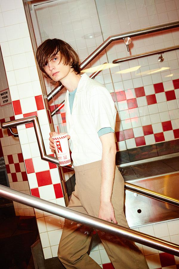 Two guys at Five Guys FS magazine style shoot. Vivien holding drink. ()